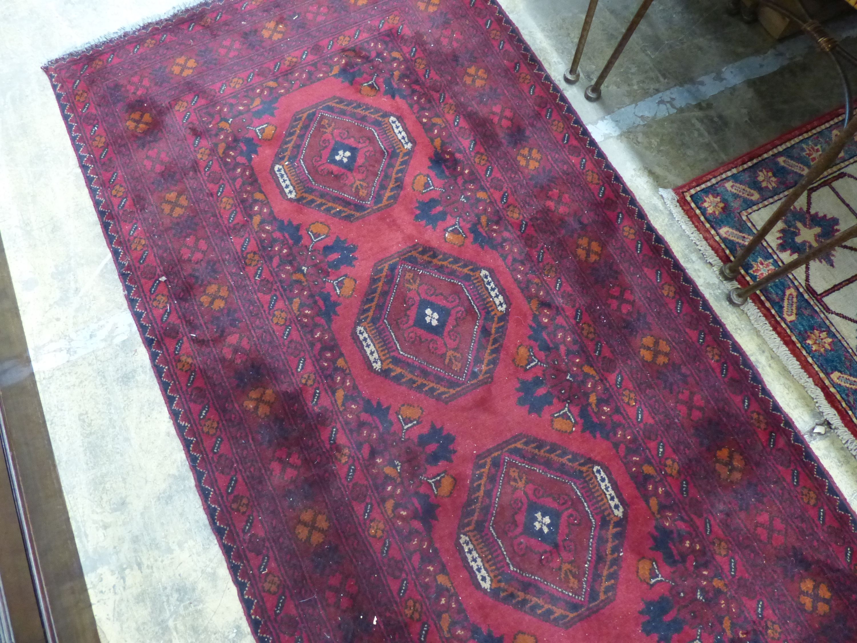 A Bokhara red ground runner, 290 x 82cm